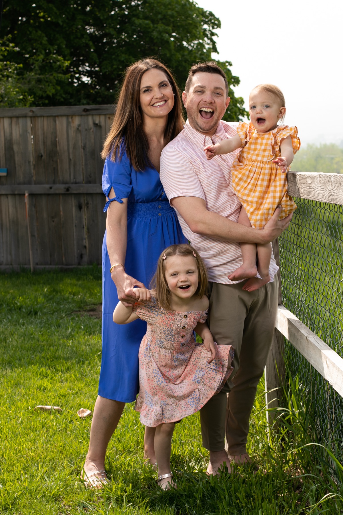 Brian Long outdoors with his wife and two daughters